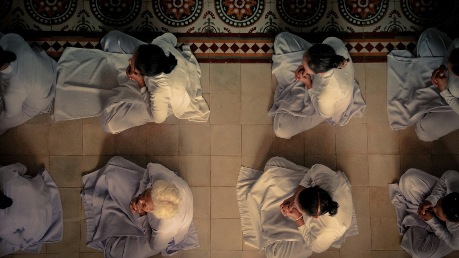 people praying in white clothes, collective prayer strengthens shared identity